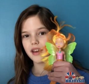 Young girl holding a pool toy